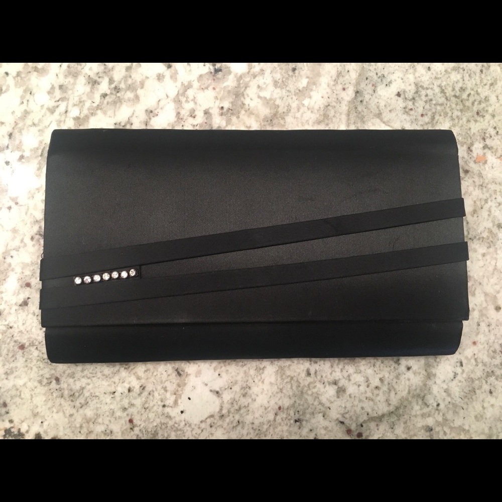 Black clutch, minor wear.